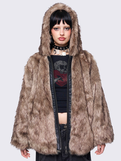 Brown faux fur hooded jacket with zip fastening and side pockets. Features a loose fit for a cozy, stylish look.