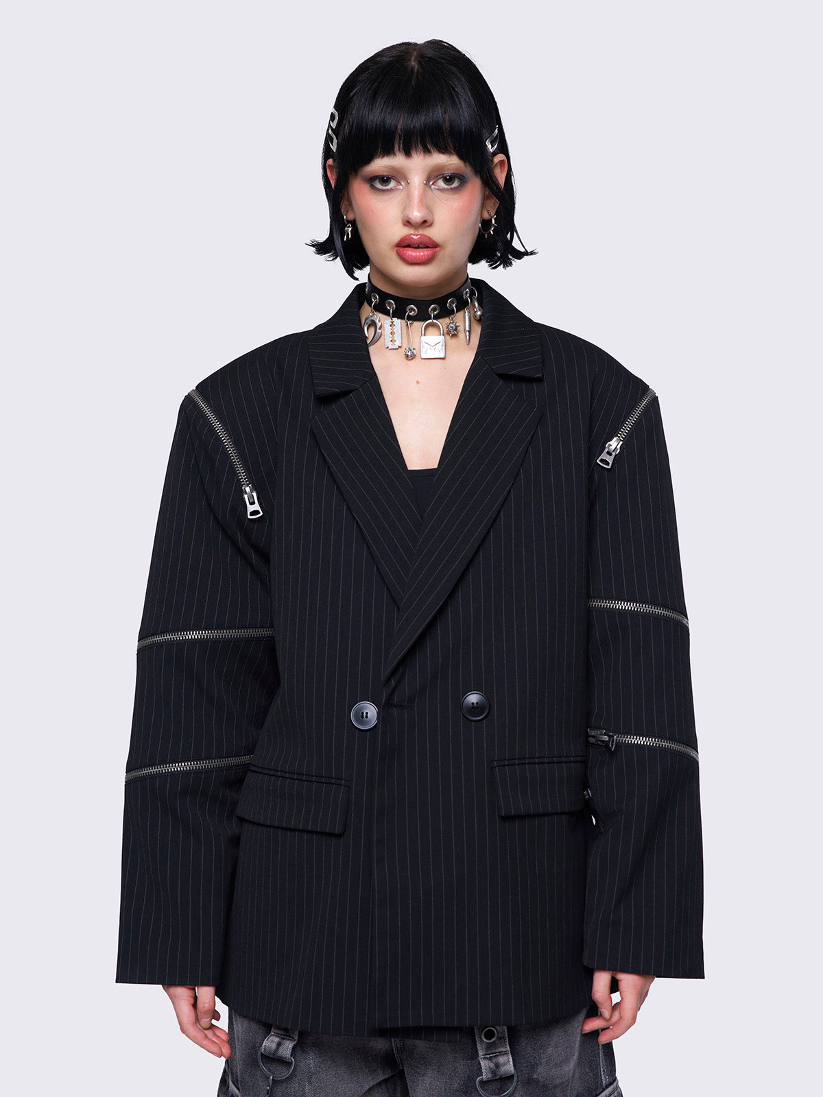 Blazer in black pinstripes with zipper details