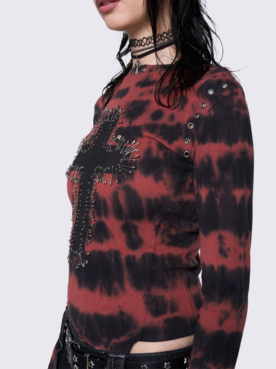 Asymmetric long sleeve top with black and red tie-dye pattern, cross patch with safety pins, silver eyelets at neckline and armhole, slim fit.