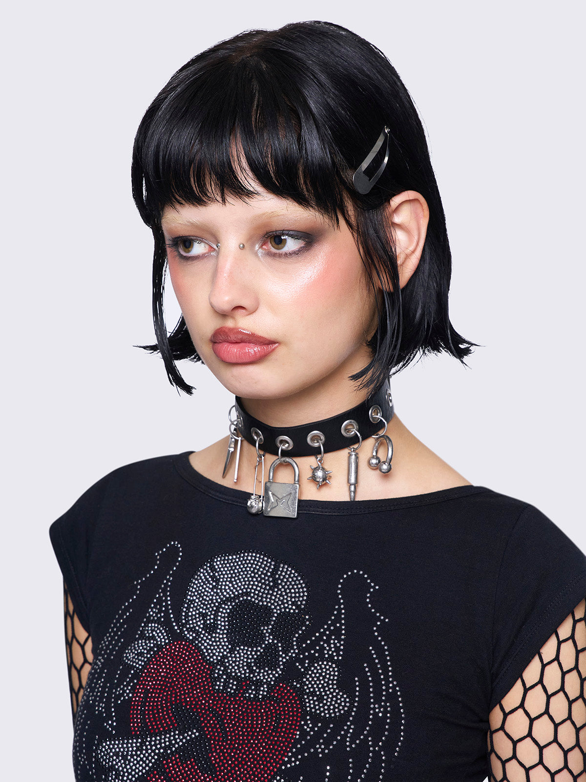 Vegan leather choker necklace with a Locker, safety pins, spikes and more pendants.