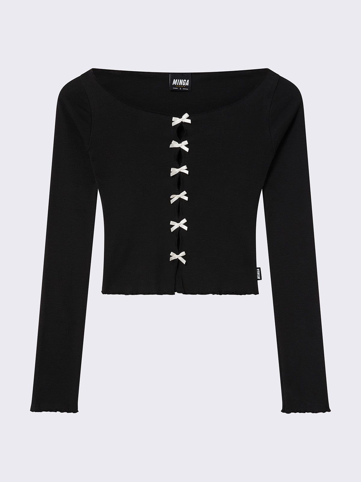 Black long sleeve top with a front cut-out adorned with white bows. Features lettuce edge trims and a boat neckline.