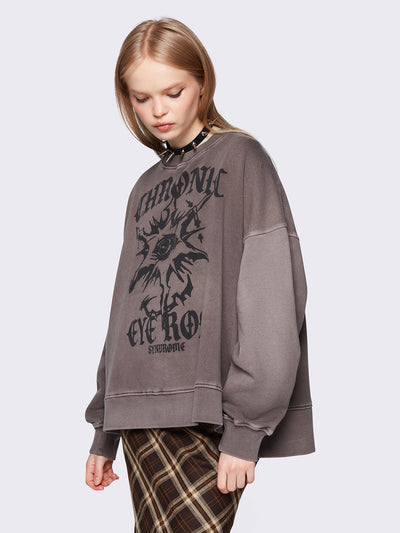 Oversized sweatshirt in washed brown with graphic front print.