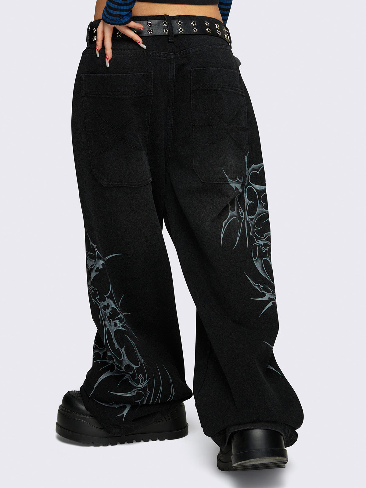 Baggy jeans in black with sigilism graphic print