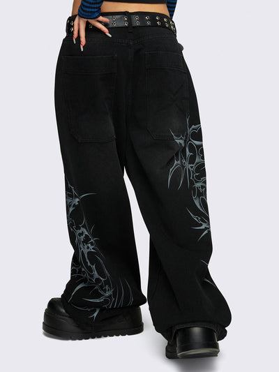 Baggy jeans in black with sigilism graphic print