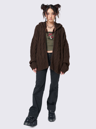 Oversized brown cable knit hooded cardigan with zip fastening and side pockets.