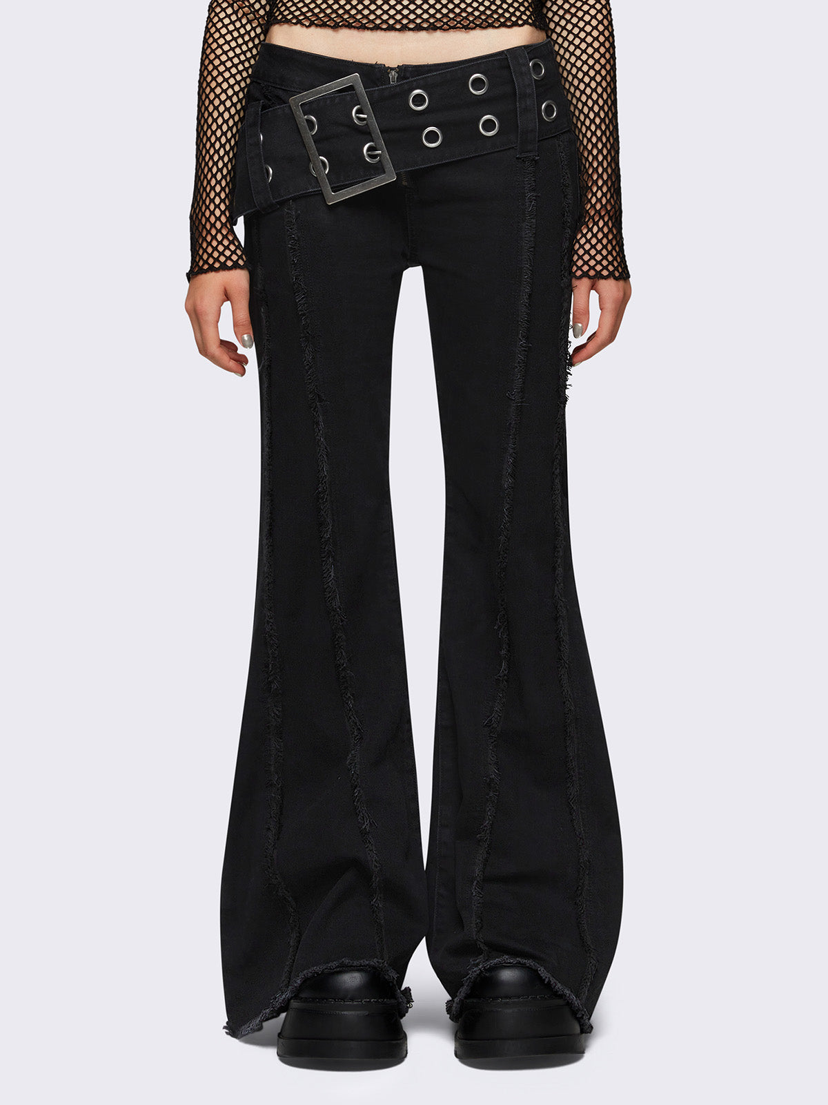 Flared jeans in black with chunky buckle belt