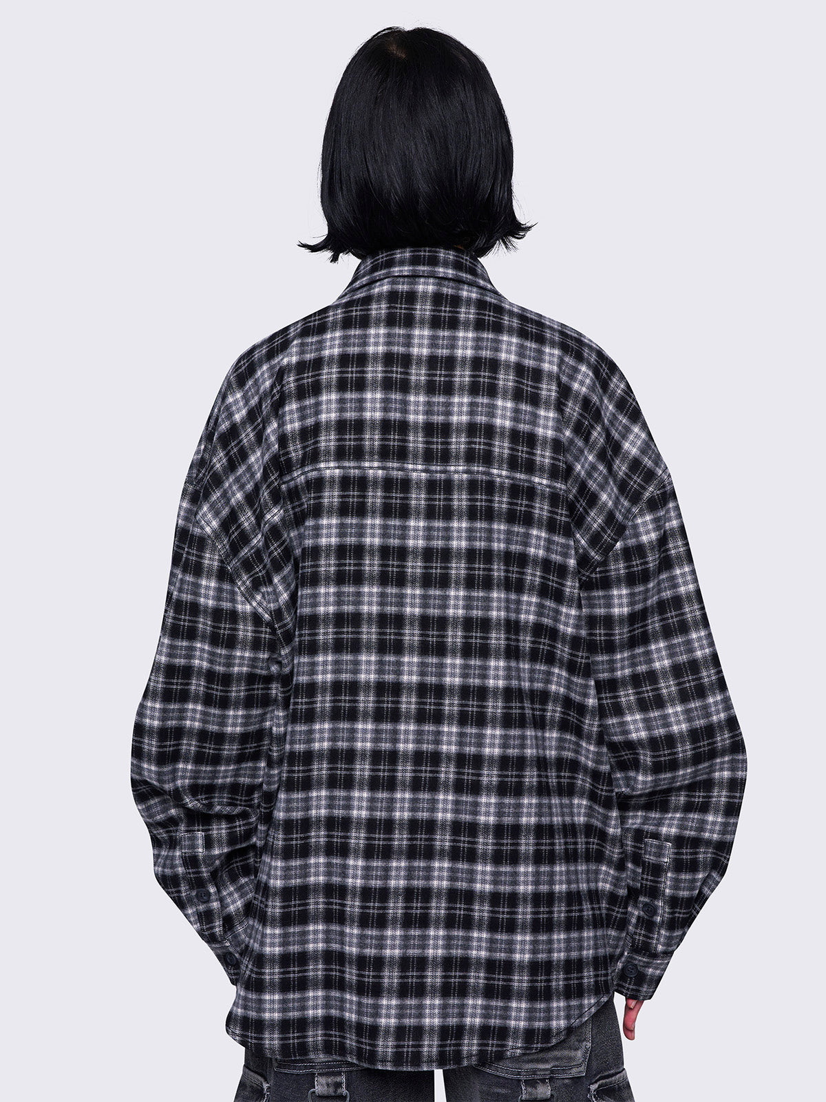 Plaid oversized shirt in black and grey with front button placket.