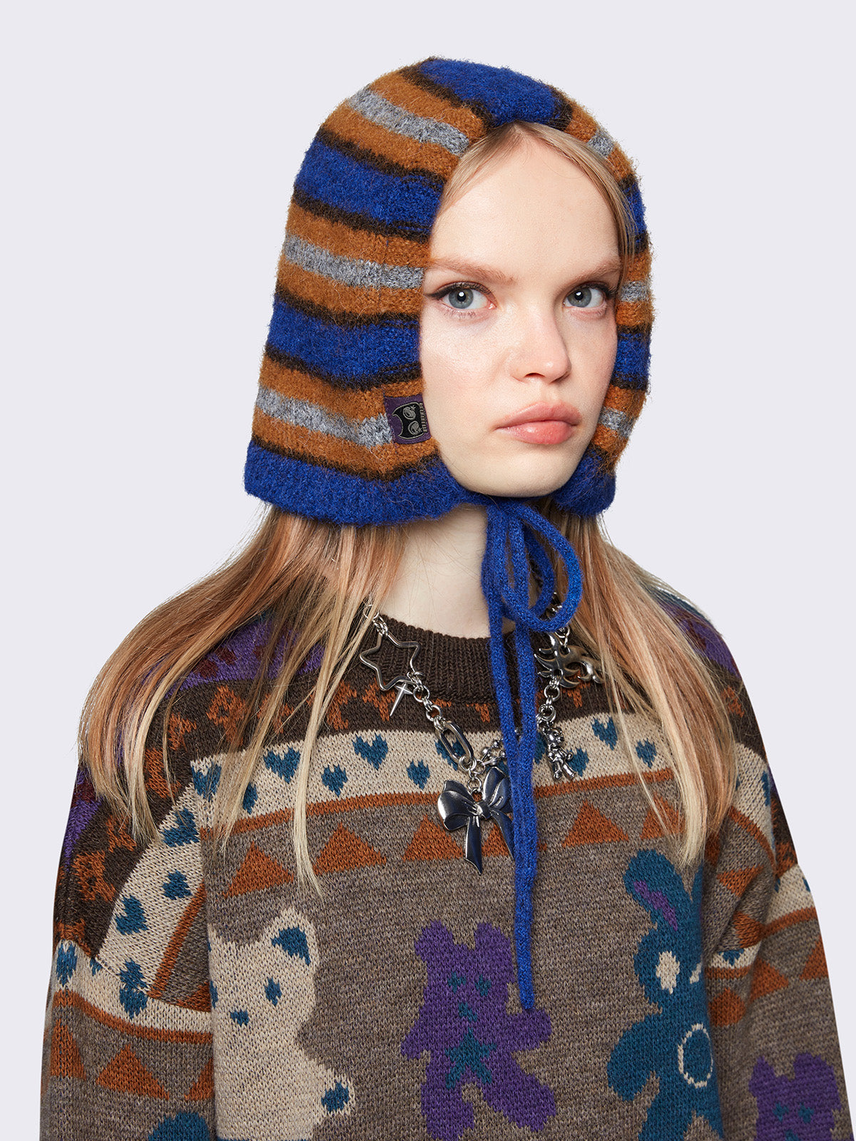 Striped knit bonnet hat in blue, orange and grey