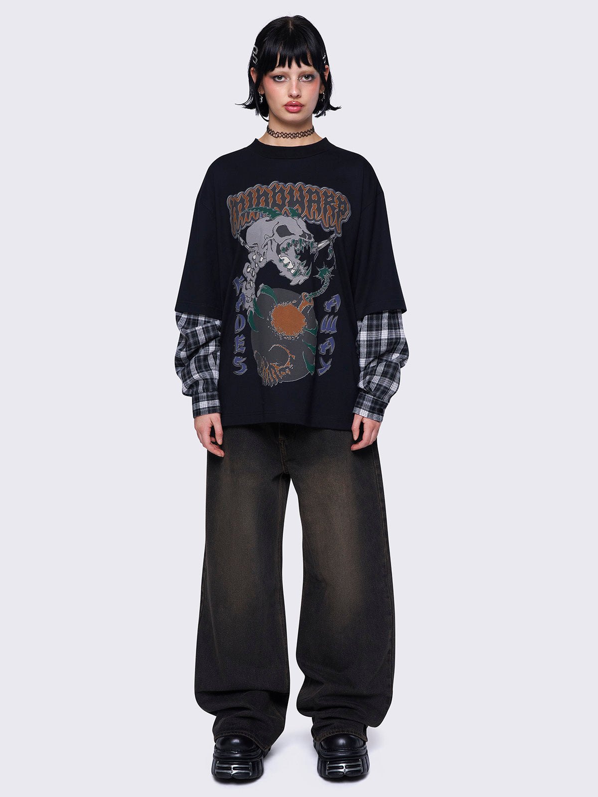 Black layered long sleeve t-shirt with contrast black and grey plaid sleeves, Mindwarp graphic front print, crew neck, and relaxed fit.