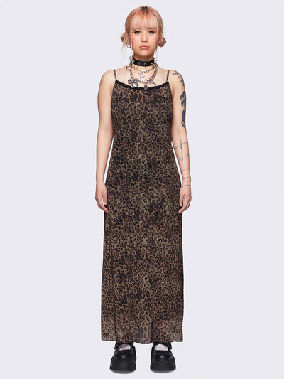 Maxi dress in leopard print featuring a lace trim neckline, adjustable cami straps and a mesh overlay. The dress is fully lined and falls to a maxi length.