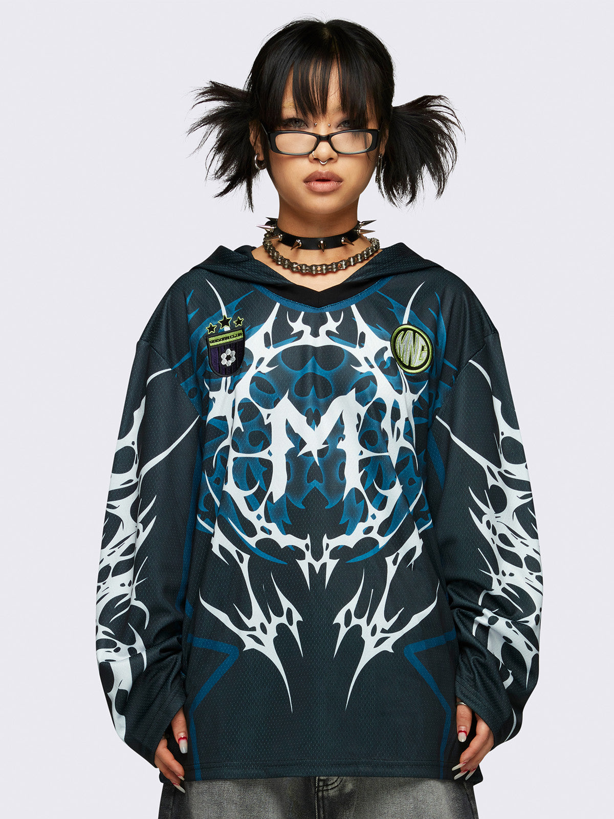 Football jersey hoodie in black with tribal graphic print in white and blue