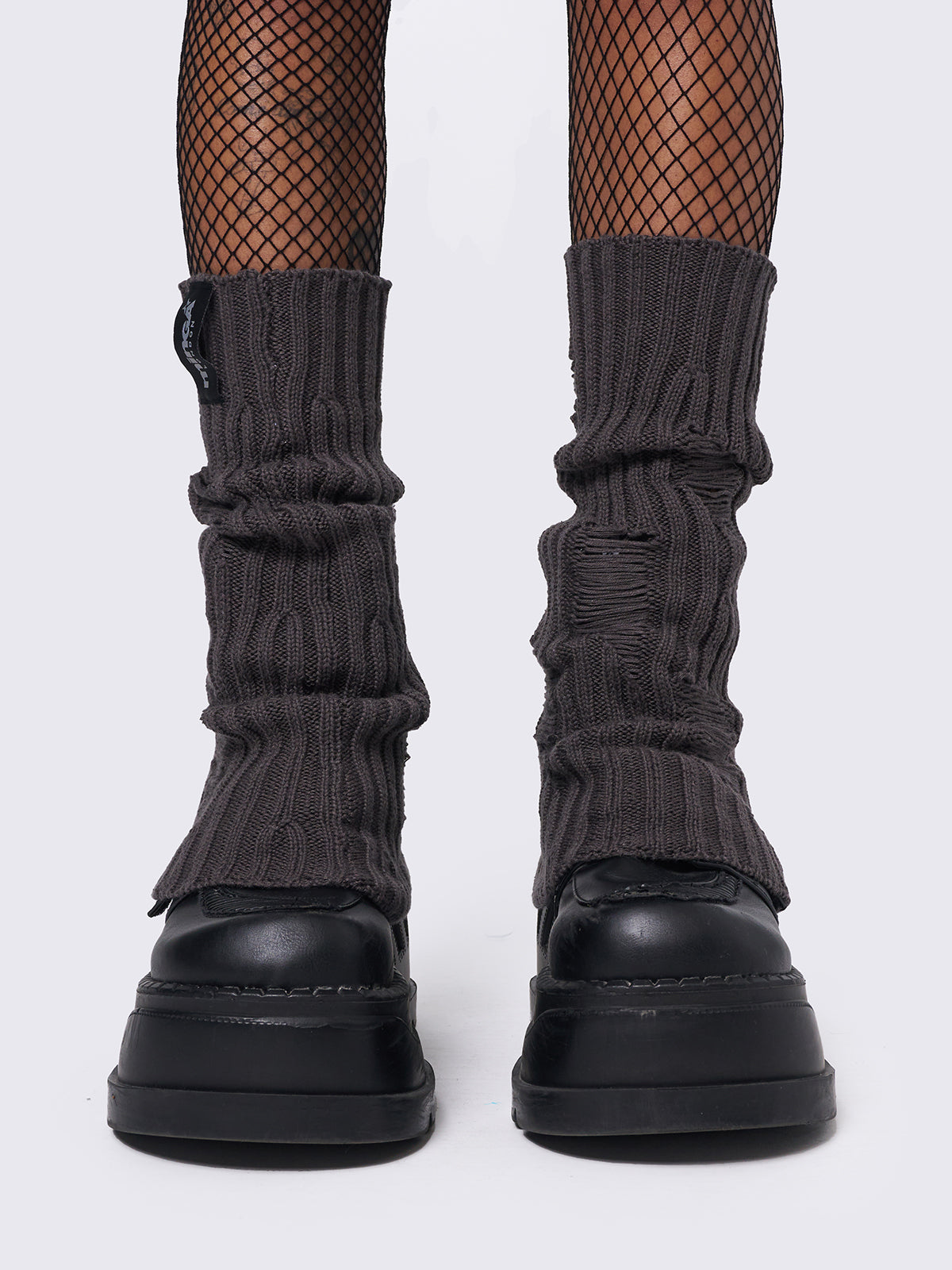 Knitted flare leg warmers in dark grey with distressed details