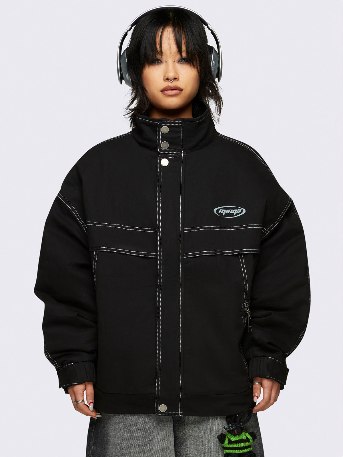 Oversized black twill bomber jacket with white contrast stitching