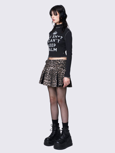 Regular waist pleated mini skirt in leopard print and contrast pleats in black. With buckle straps and D-rings details.