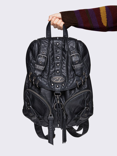 Vegan leather backpack in black with O-rings, spikes and buckles details in silver