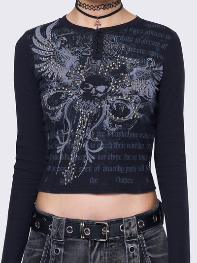 Black long-sleeve top with dagger skull graphic, studded details, slim fit, rounded neckline, and half button placket. Grunge and Y2K aesthetic