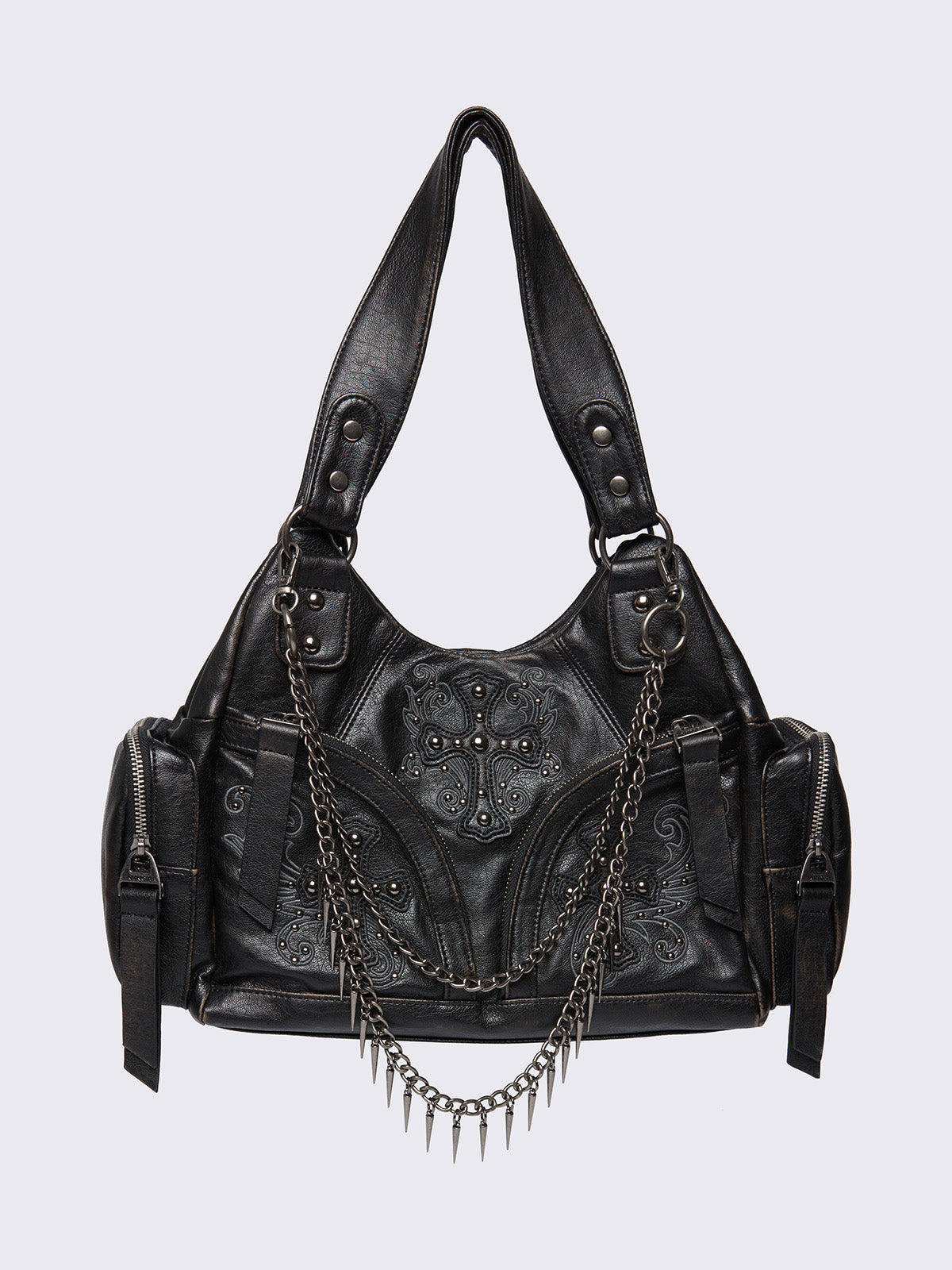 Washed black faux leather shoulder bag featuring studded cross patches, spike and chain accents, and multiple pockets.