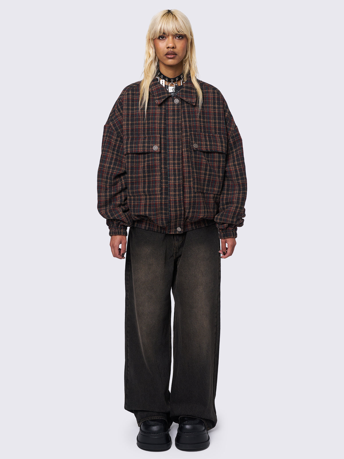 Wool bomber jacket in brown, blue and burgundy plaid pattern featuring a boxy oversize fit