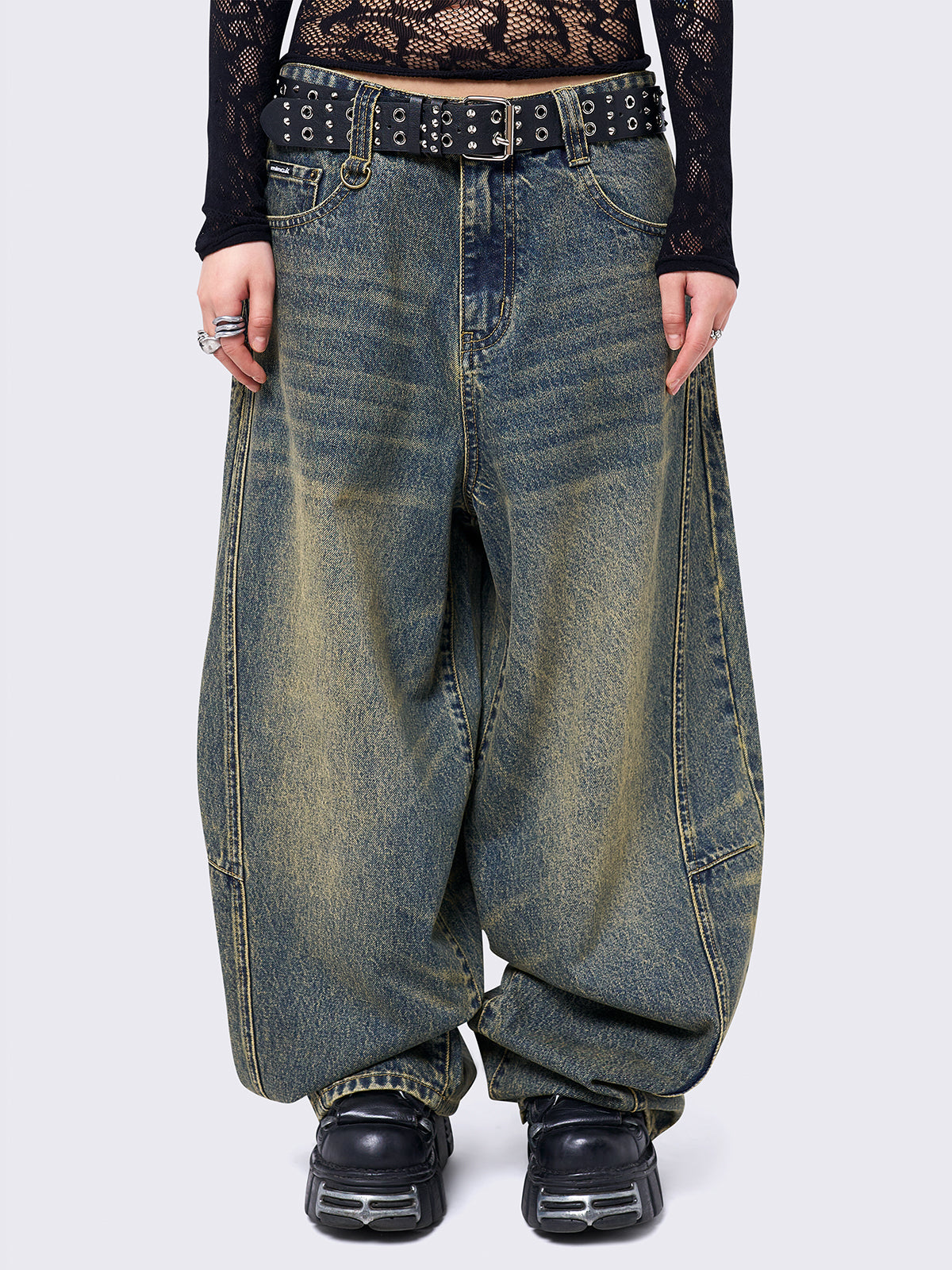 Blue washed super baggy jeans with green overdye, a relaxed fit, regular waist, zip fly, button fastening, and belt loops. Trendy streetwear style.