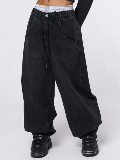 Oversized balloon jeans in washed black featuring elasticated drawstring waist