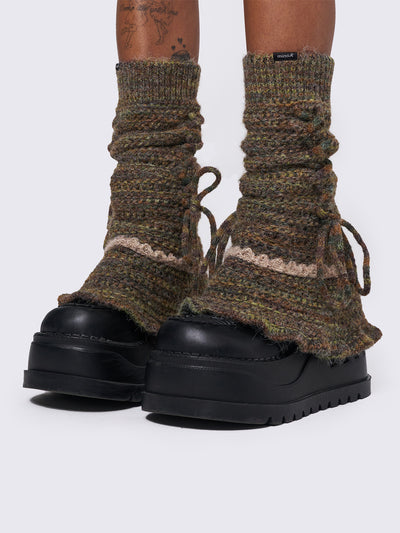 Boho crochet flared leg warmers featuring a space-dye design, lace up and ruffles details.