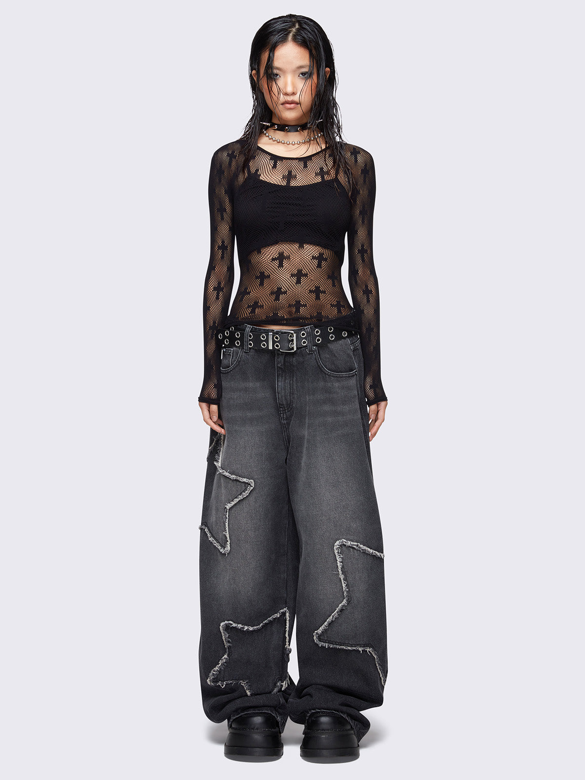 Fishnet top in black and with all over crosses design.