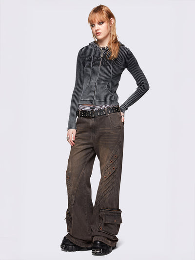 Grey washed flare baggy jeans with brown overdye, twist seam, eyelet details and utility ankle pockets.