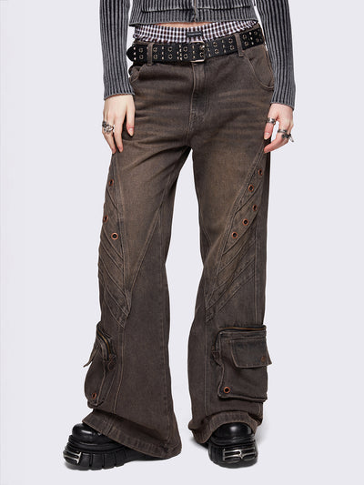 Grey washed flare baggy jeans with brown overdye, twist seam, eyelet details and utility ankle pockets.