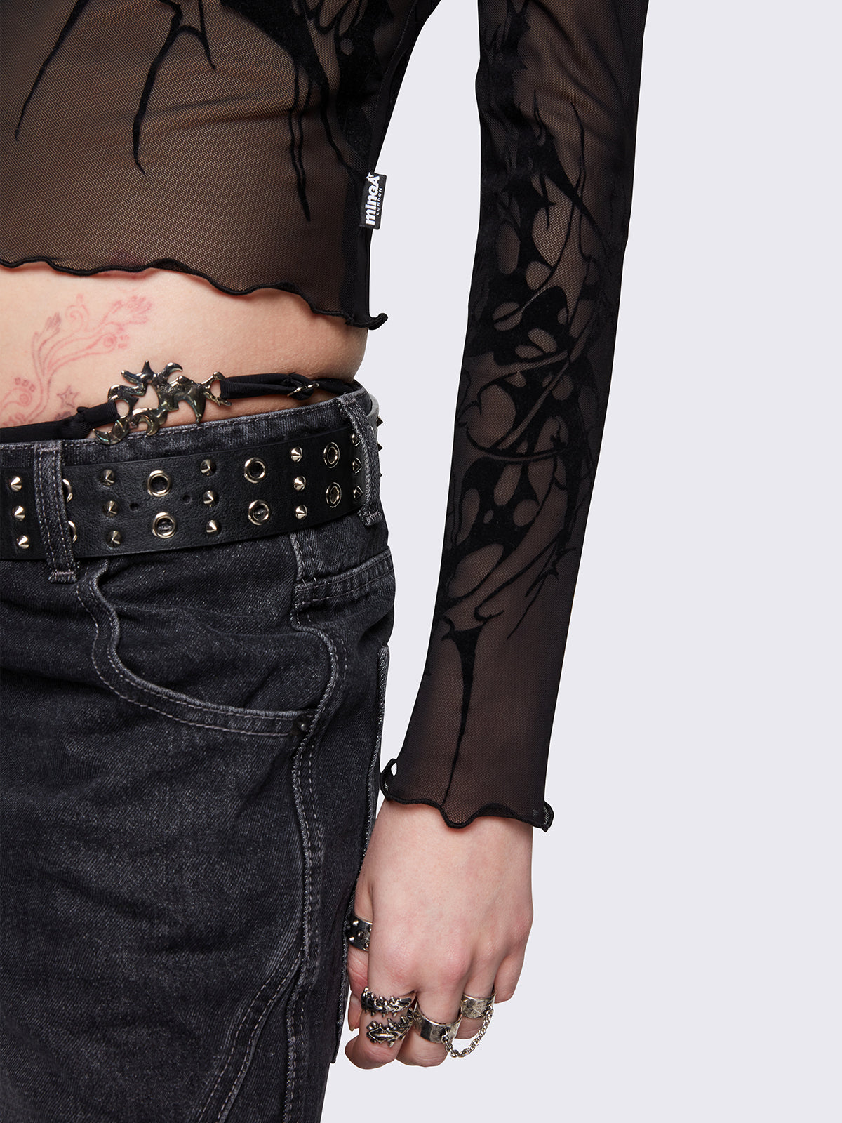 Black mesh top with all over sigilism graphic flock print.