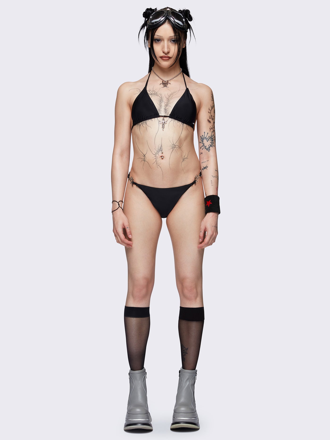 Slim straps bikini bottoms in black with metal details 