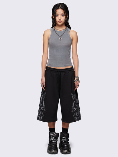 Black oversized longline sweat shorts with sigilism graphic print.