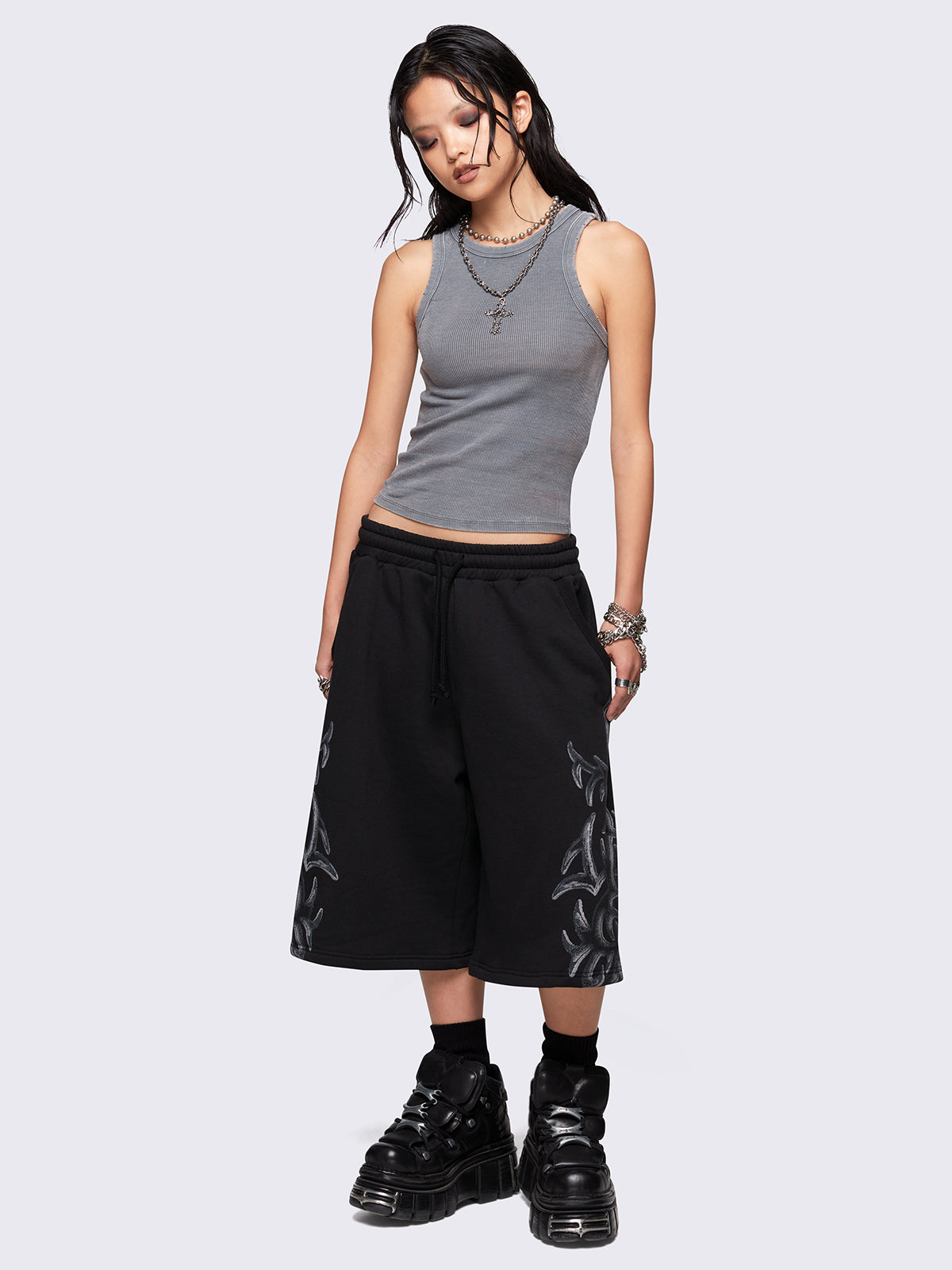 Black oversized longline sweat shorts with sigilism graphic print.