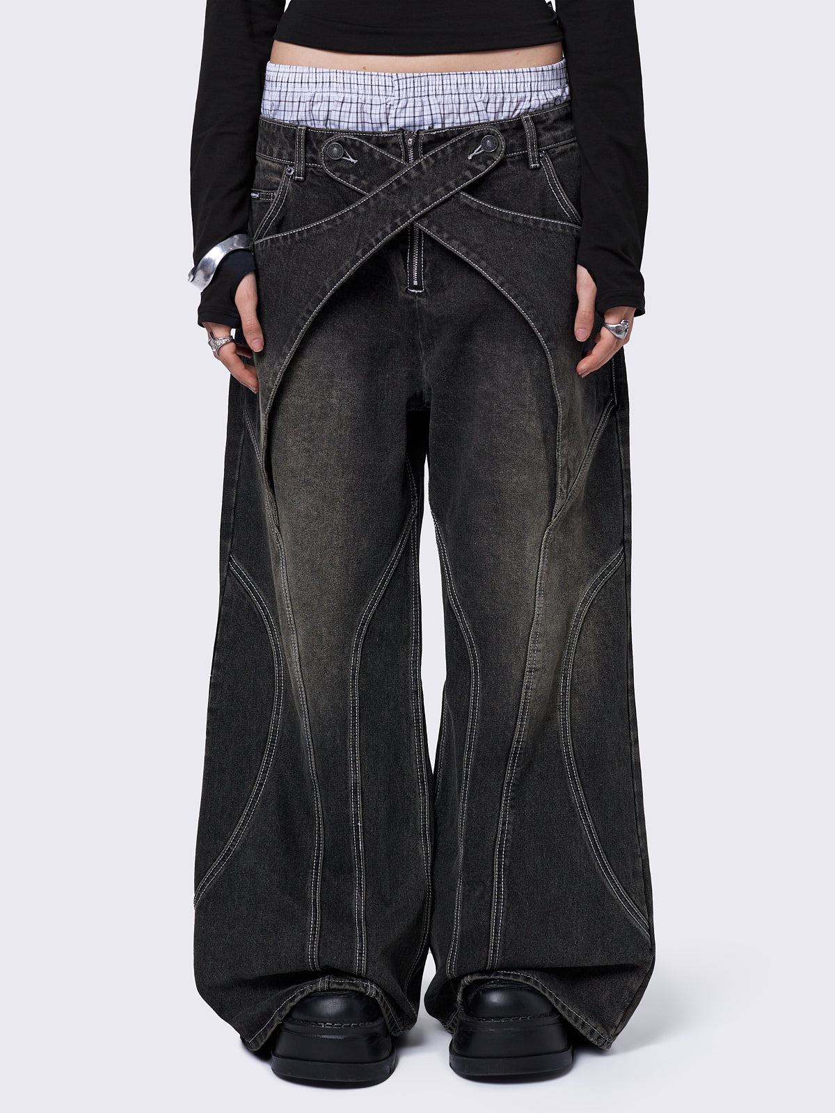 Black washed baggy jeans with green overdye and cross panels and seams details. 