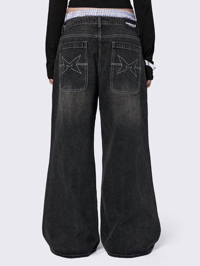 Black washed baggy jeans with green overdye and cross panels and seams details. 