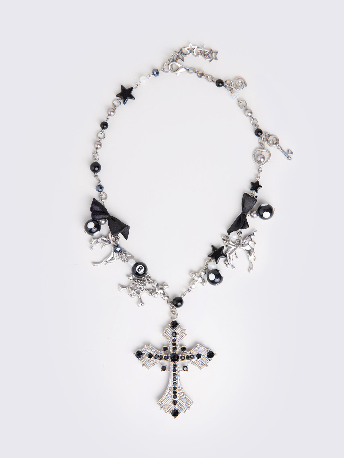 Black beaded necklace with cross pendant and more detail