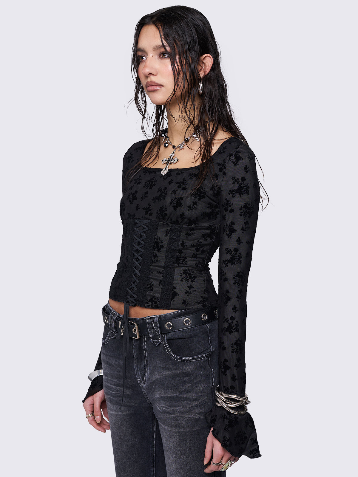 Mesh top in black with all over velvet floral print and lace up front design