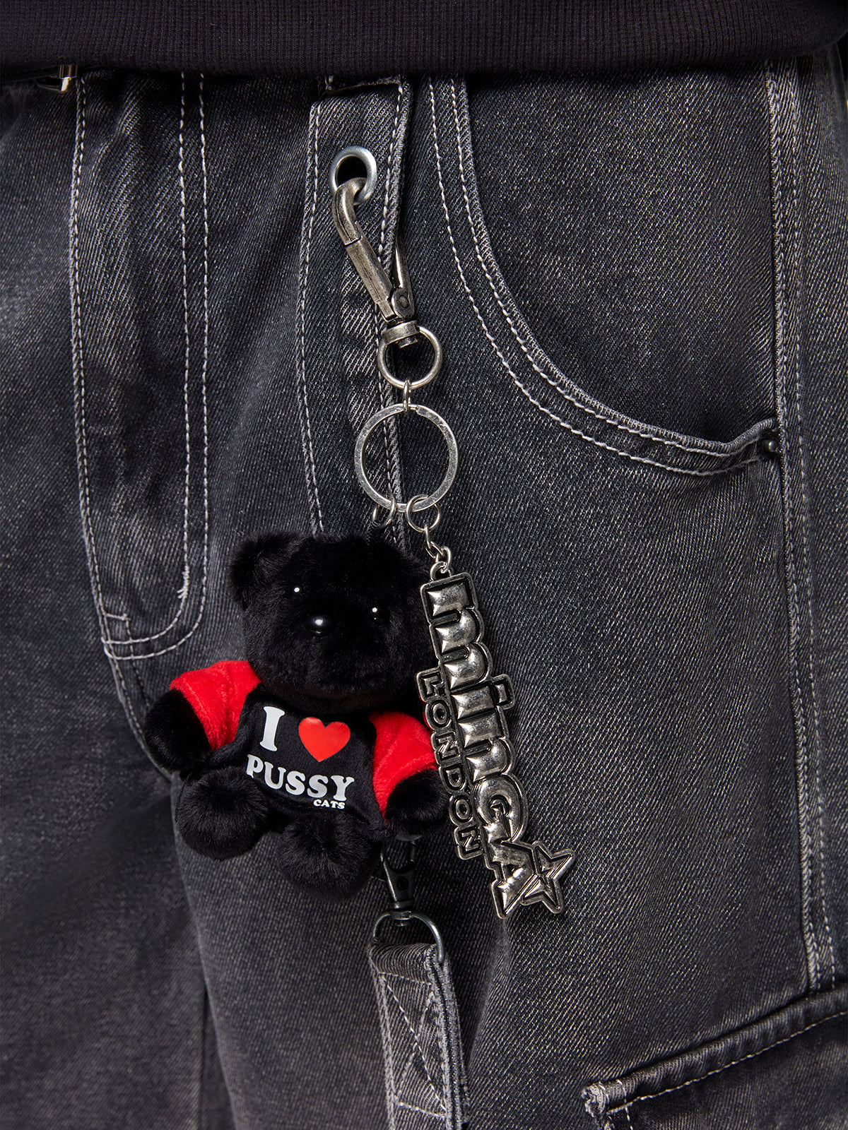 Clasp keychain with black plush teddy bear and Minga metal plate.