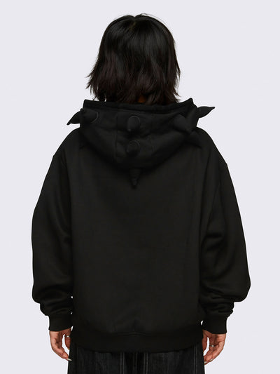 Black zip-up hoodie jacket featuring 3D spikes, green Minga embroidery, a drawstring hood, and zip fastening.