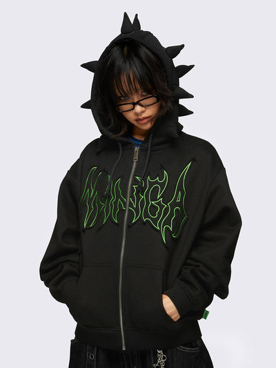 Black zip-up hoodie jacket featuring 3D spikes, green Minga embroidery, a drawstring hood, and zip fastening.