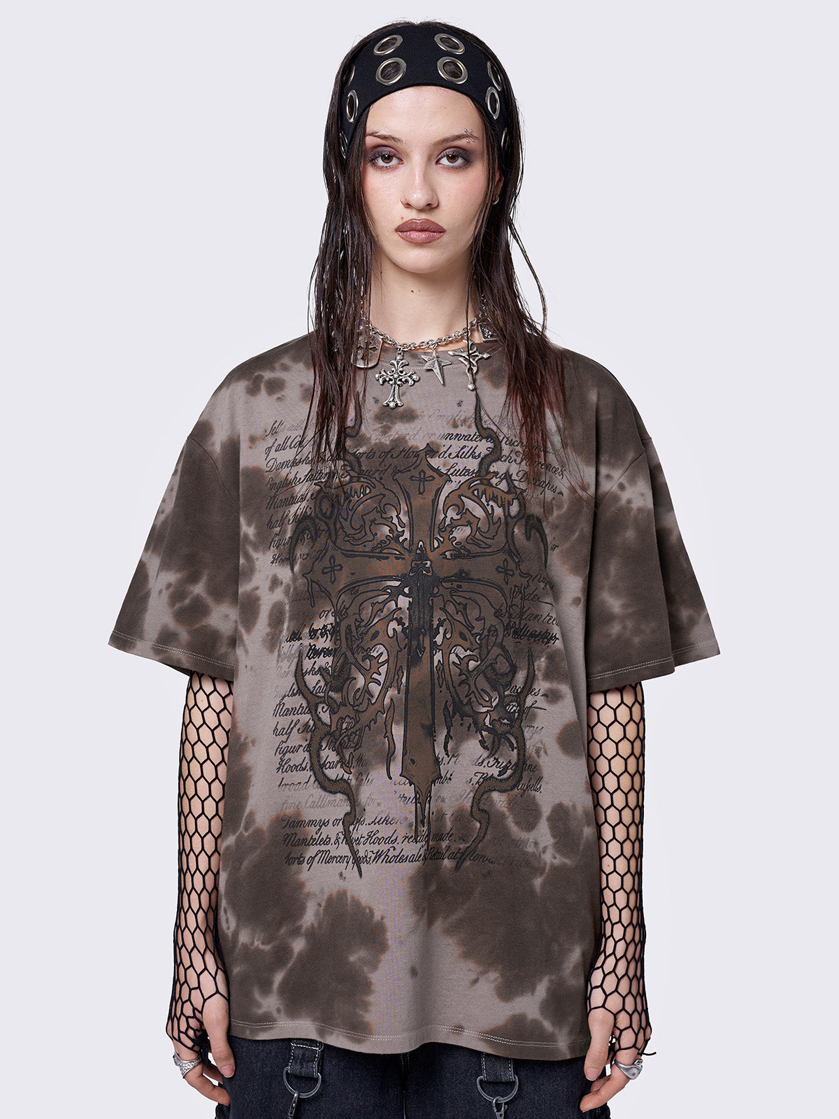 Brown tie dye t-shirt with cross and letters graphic front print.