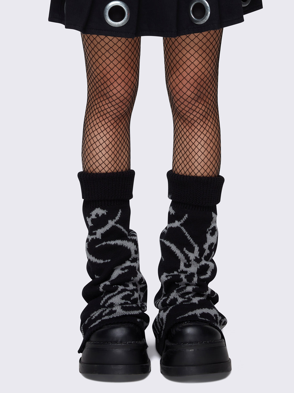 Flared leg warmers in black and sigilism graphic design in grey