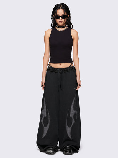 Black washed wide leg sweatpants with grey sigilism patches.