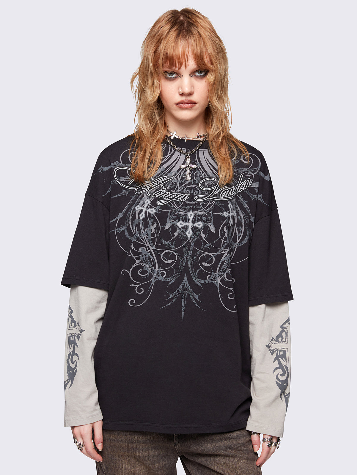 Black layered long sleeve t-shirt with grunge graphic front print and off-white contrast sleeves with cross print. Relaxed fit and crew neck.