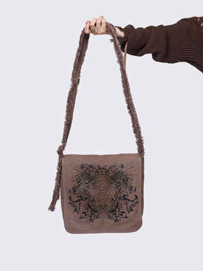 Canvas messenger bag in washed brown with grunge graphic print with gold studs details.