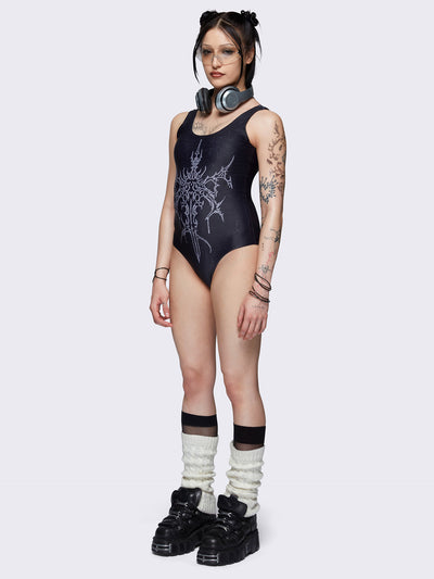 One-piece swimsuit in black with dagger graphic print