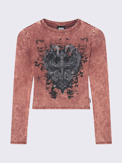 Slim fit long sleeve top in washed terracotta red. Winged cross front graphic print and rounded neckline