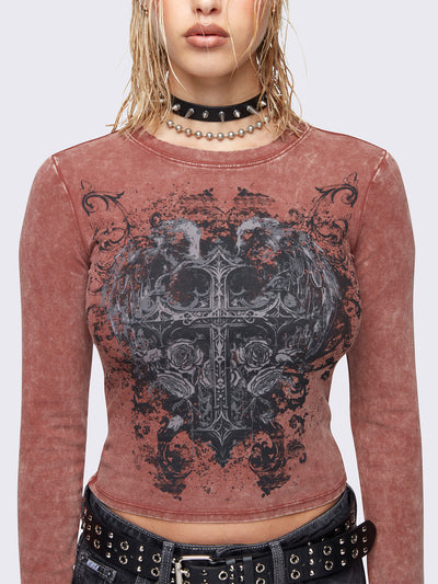 Slim fit long sleeve top in washed terracotta red. Winged cross front graphic print and rounded neckline