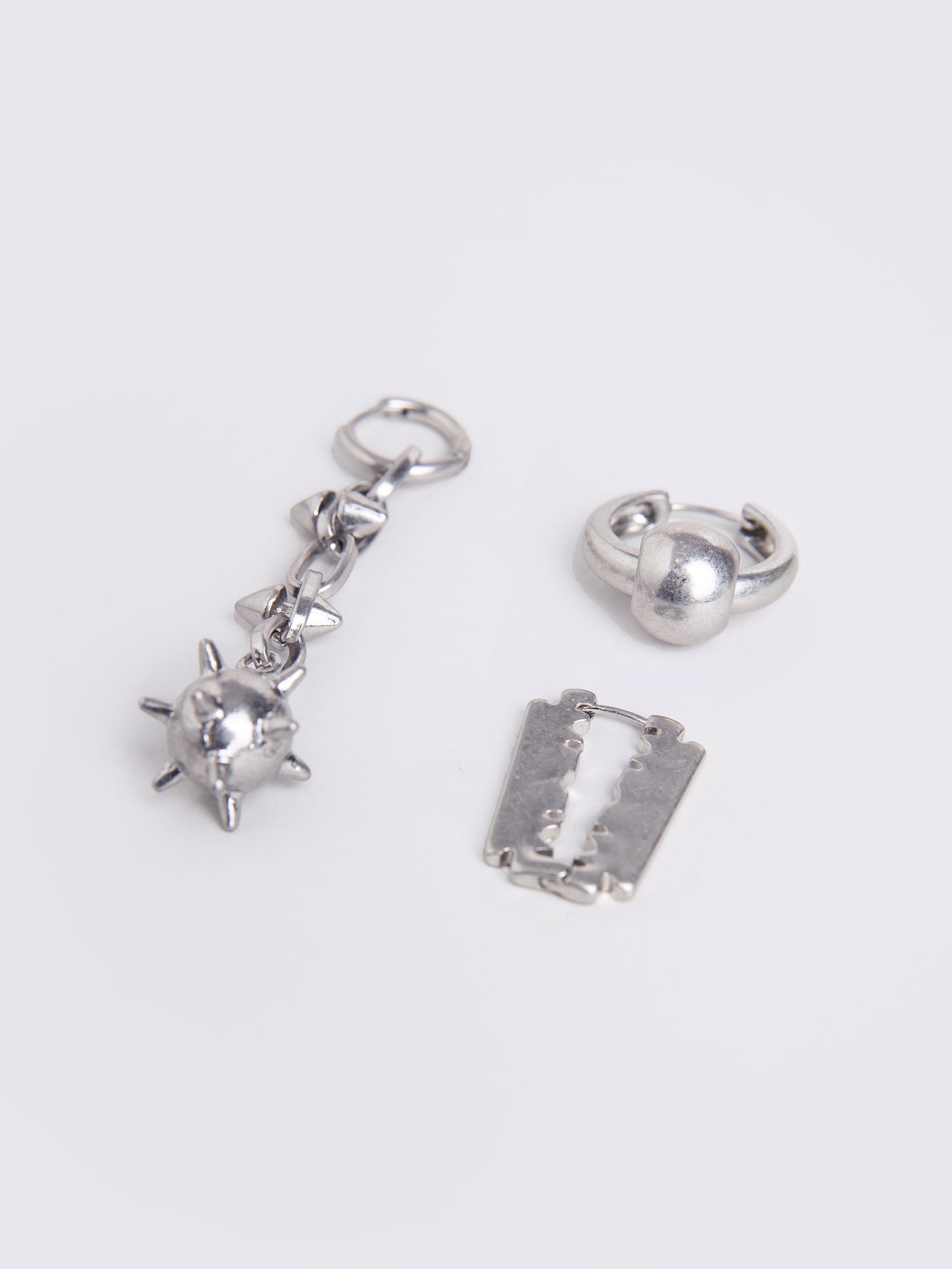 silver 3 pieces earring set  with spiked ball pendant and razor blade.