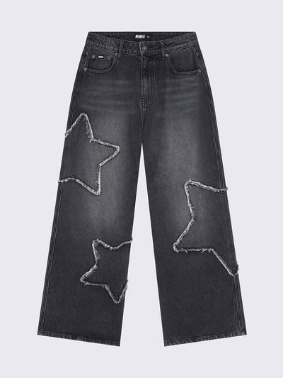 Baggy jeans in washed black with frayed star patches and wide leg fit. 