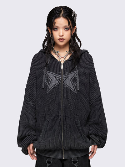 Black washed oversized hoodie cardigan featuring a signature graphic front print. Designed with a chunky ribbed knit, drawstring hood, zip fastening, and kangaroo pockets. The drop shoulders and long sleeves enhance its relaxed, streetwear-inspired fit.